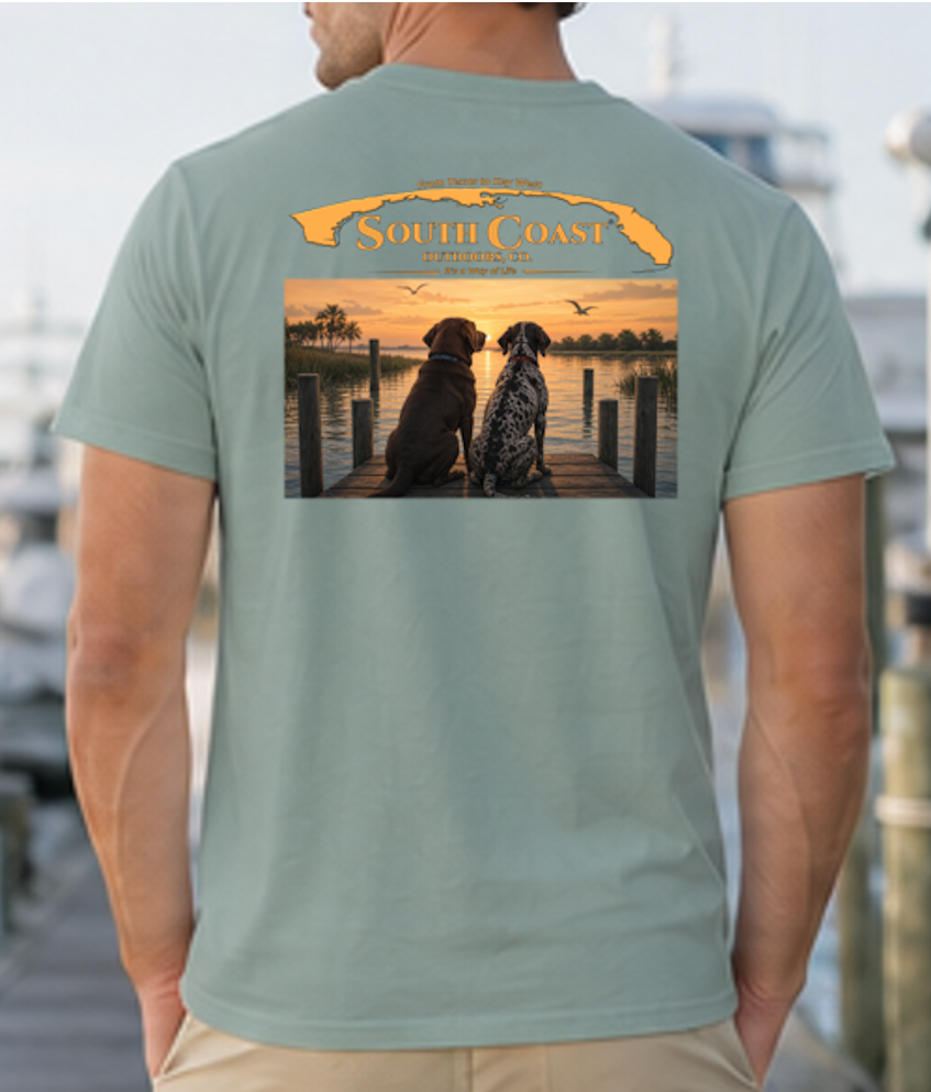 Green T-shirt with back graphic of two dogs on dock at sunset.