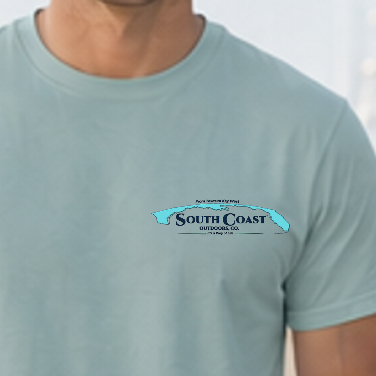 Light blue crewneck t-shirt with small chest South Coast Outdoors logo