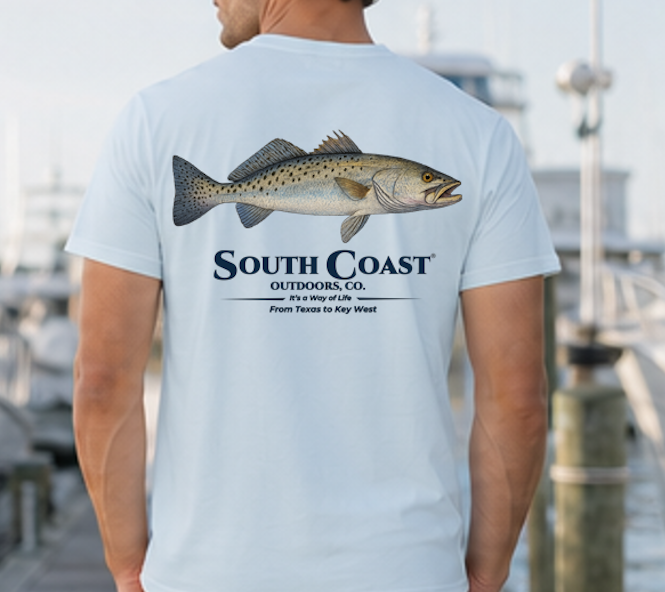 Light blue speckled trout fishing T-shirt, back fish graphic with South Coast Outdoors logo.
