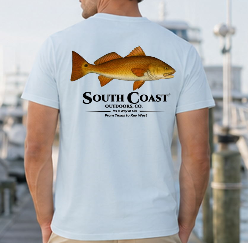 Men's light blue fishing graphic T-shirt with orange fish and South Coast logo on back