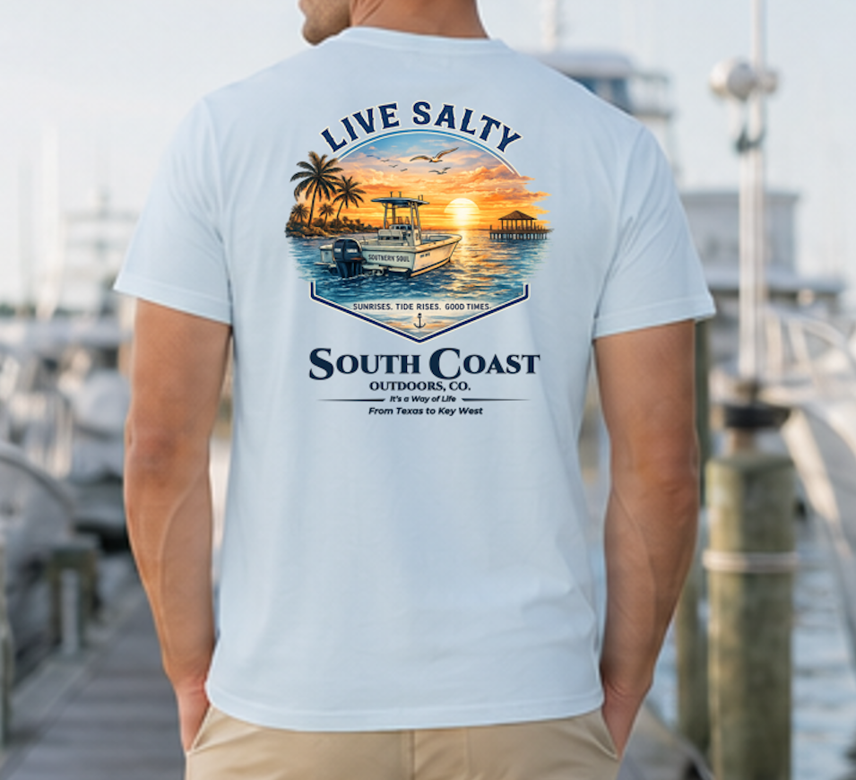 Light blue graphic t-shirt with sunset boat and palm print, 'Live Salty' text on back