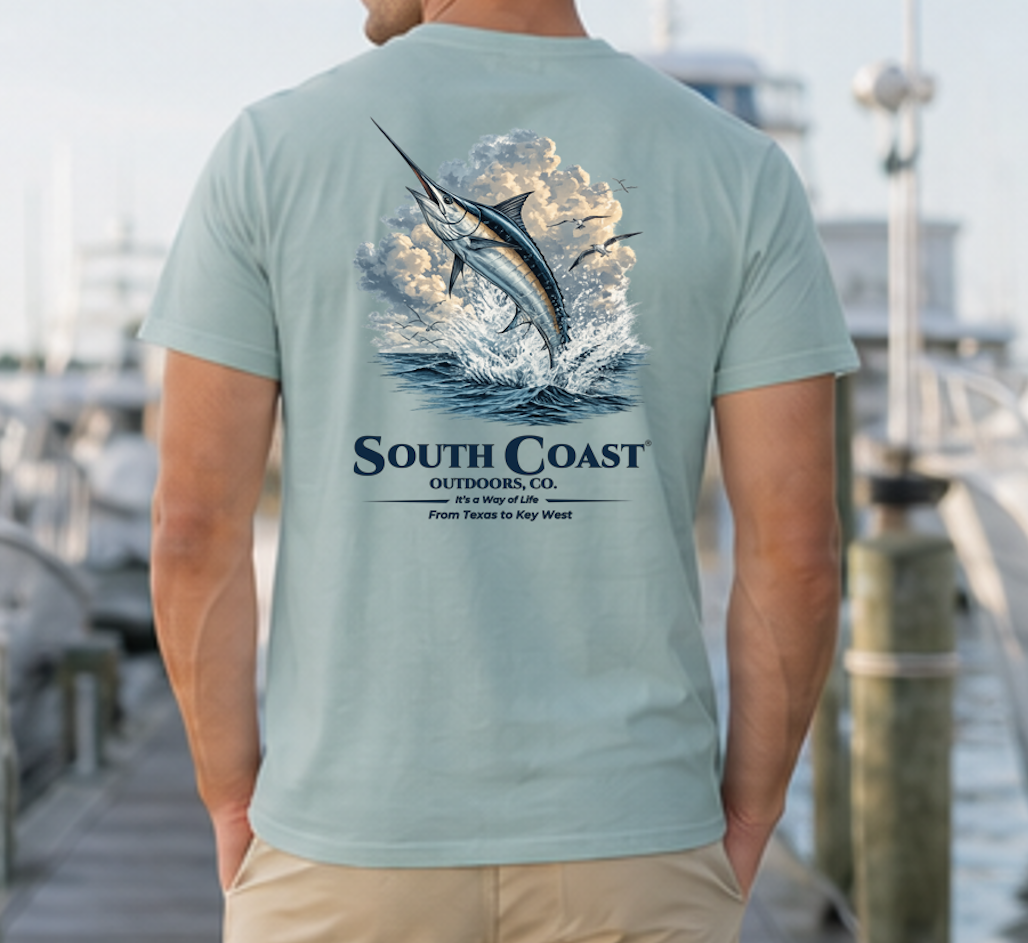 Fishing graphic t-shirt, seafoam green with marlin in waves and South Coast Outdoors Co text.