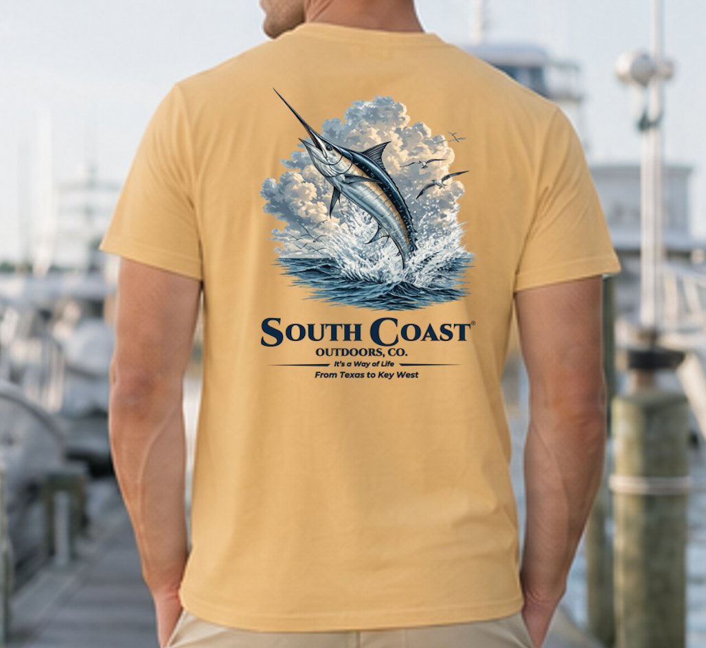 Fishing graphic t-shirt, light tan with marlin in waves and South Coast Outdoors Co text.